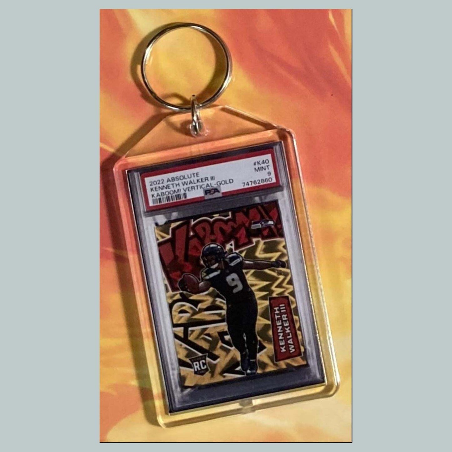 3770 Kenneth Walker III 2022 Panini Absolute Kaboom Gold Hand Made Keychain FBL