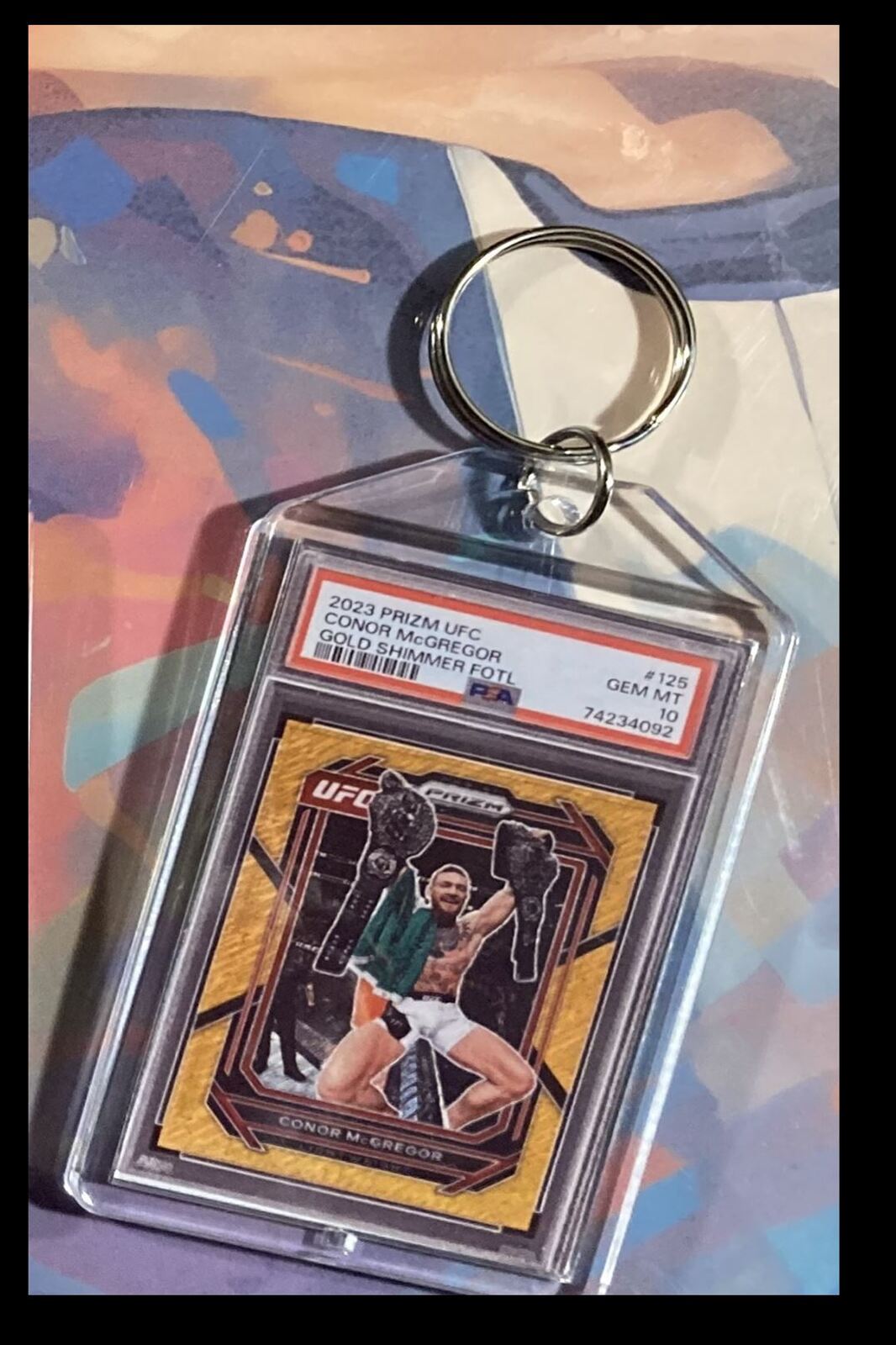 3097 Conor McGregor 2023  Panini Prizm Gold Shimmer Keychain KYC MSC