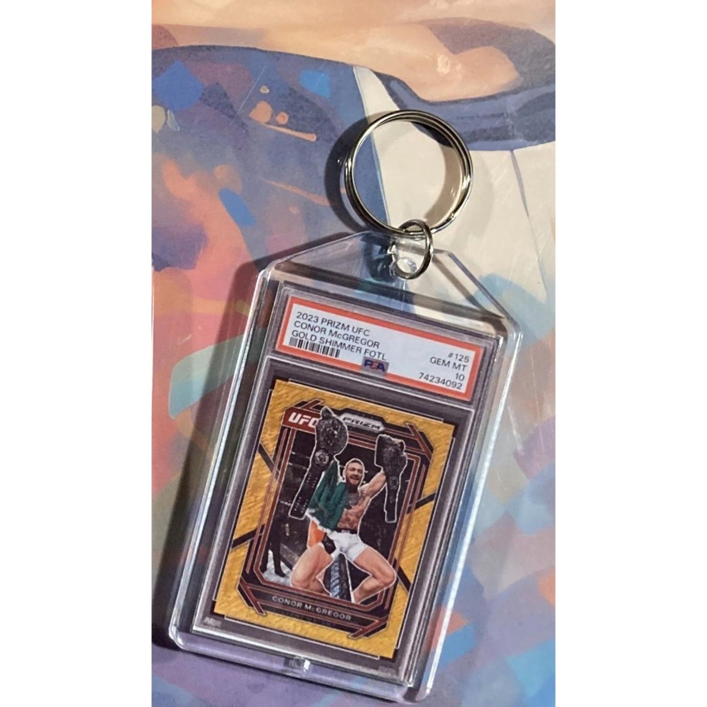0140 Conor McGregor 2023 Panini UFC Prizm Gold Shimmer FOTL Novelty Keychain